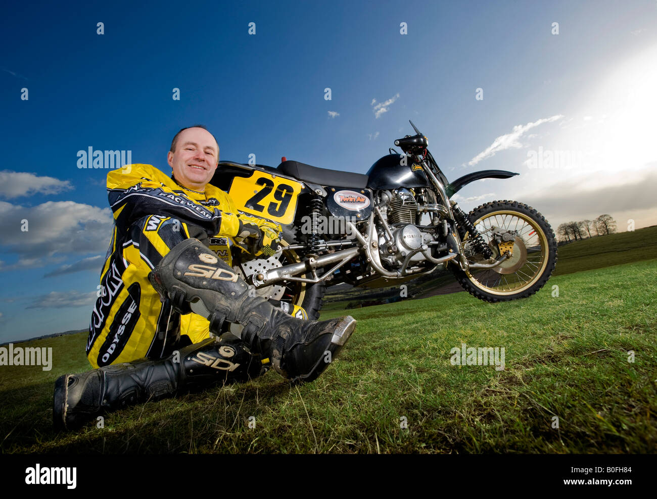 Twin shock vintage motocross rider MX dirt muddy with knobbly tyres tires twin-shock dirt bike MX Moto-X mudguard sidecar Stock Photo