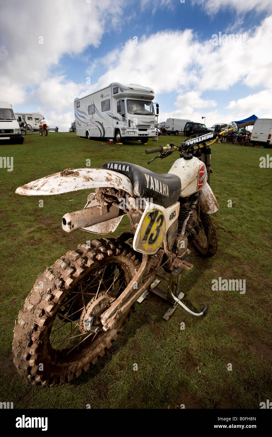 Twin shock vintage motocross rider MX dirt muddy with knobbly tyres tires twin-shock dirt bike MX Moto-X mudguard p Stock Photo