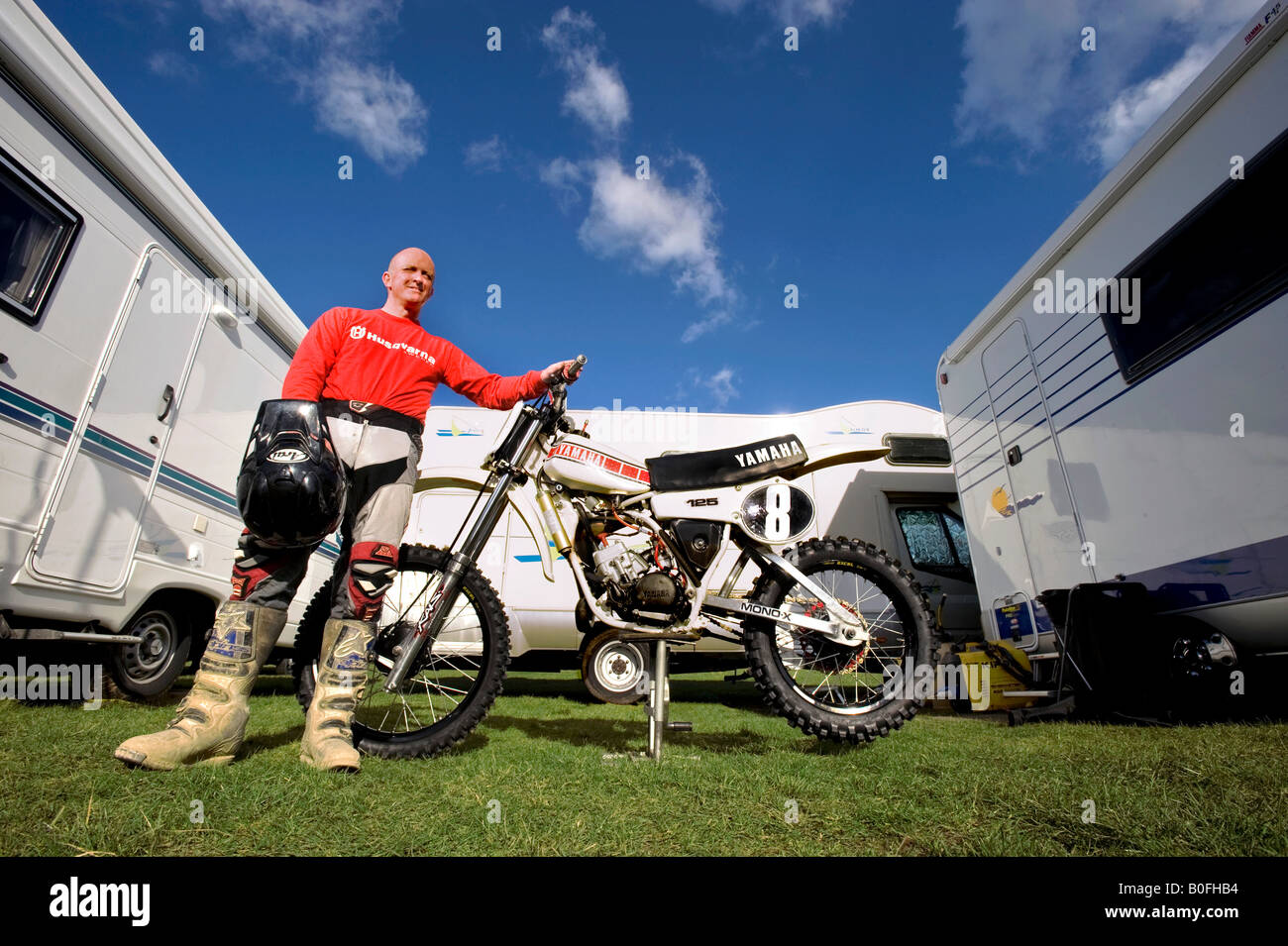 Twin shock vintage motocross rider MX dirt muddy with knobbly tyres tires twin-shock dirt bike MX Moto-X mudguard power racer Stock Photo