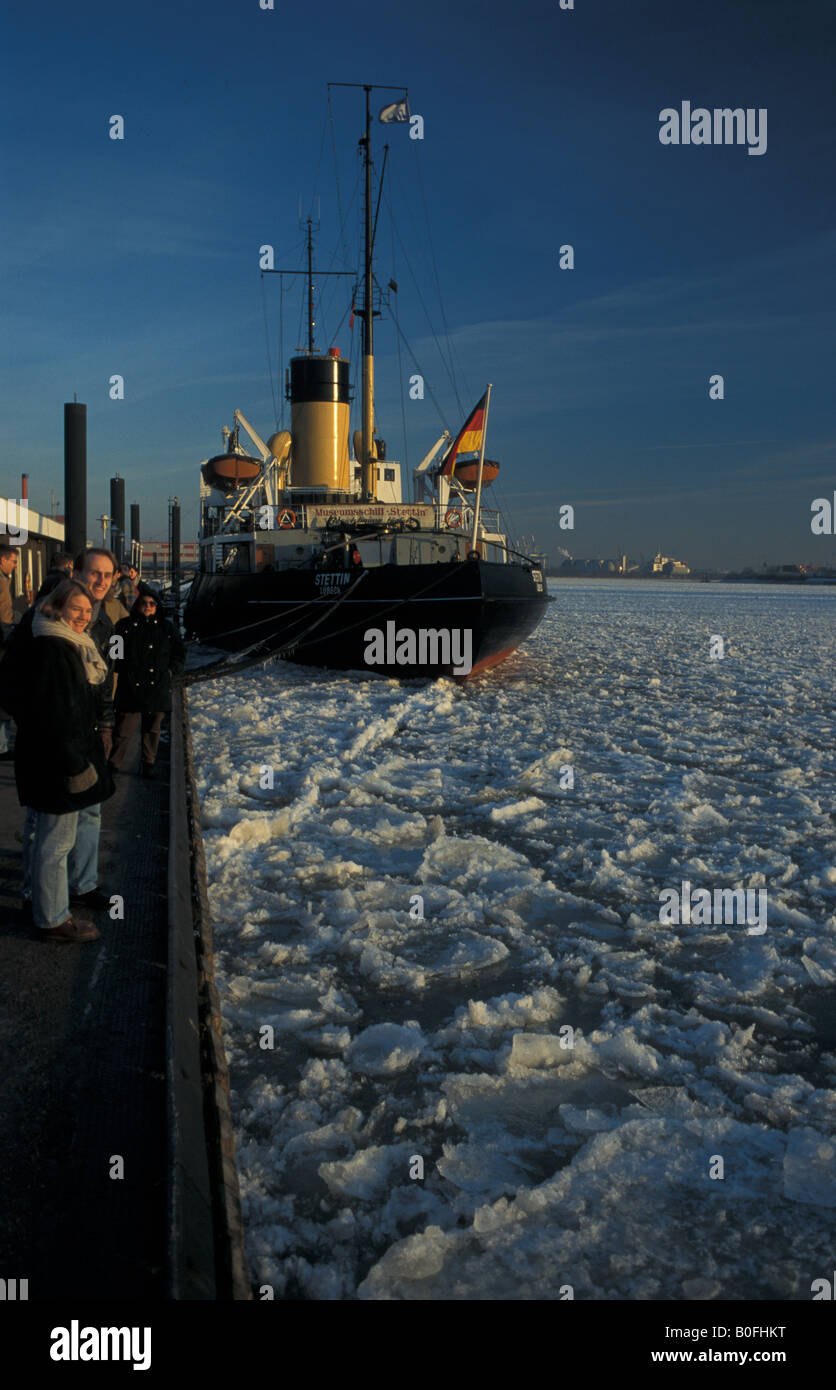 Pier "Neumuehlen", historic icebreaker "Stettin" and floating ice on