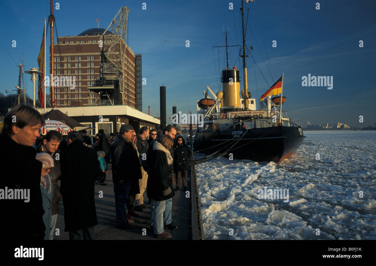 Historic icebreaker "Stettin", people waiting for harbour ferry at pier