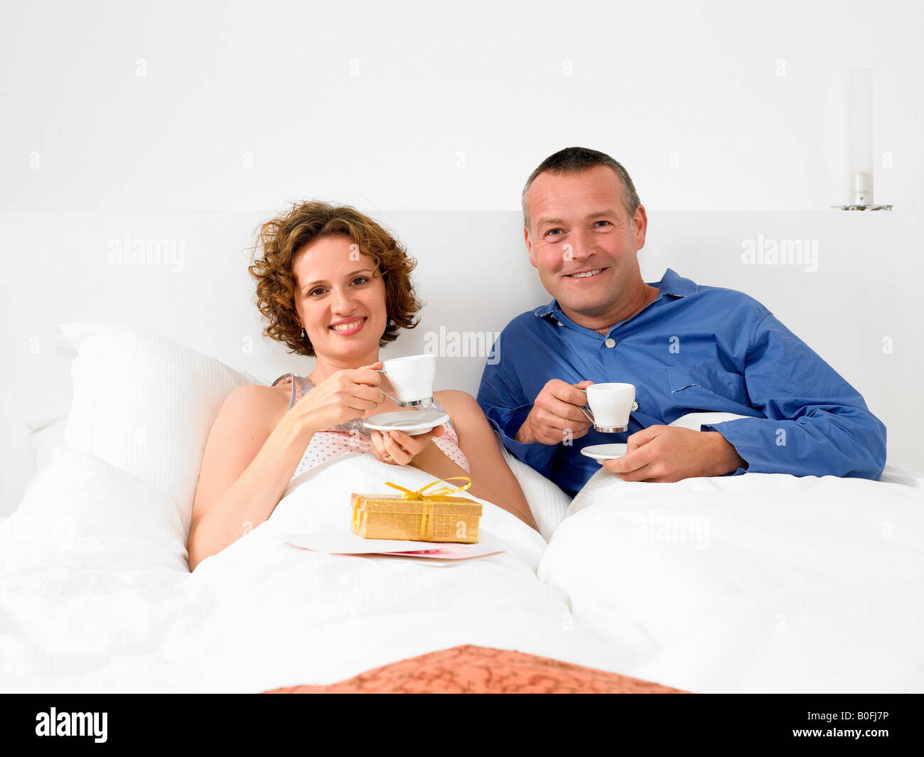 Portrait of man and woman in bed Stock Photo - Alamy