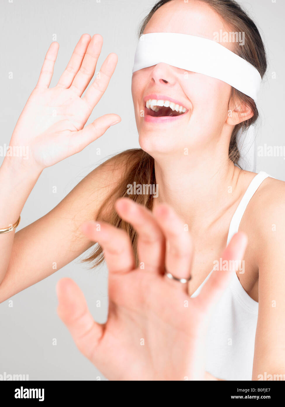 Young blindfolded woman Stock Photo by ©VGeorgiev 100898414