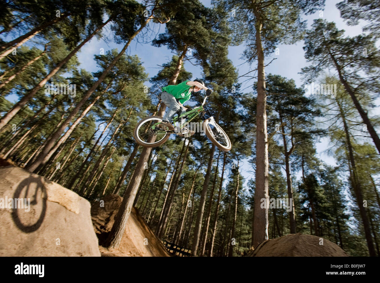 mountain bike dirt jump trick stunt air leap bmx mountain bikes MTB BMX  dirt jumper pulls stunts in trees sick whip youth sport Stock Photo - Alamy