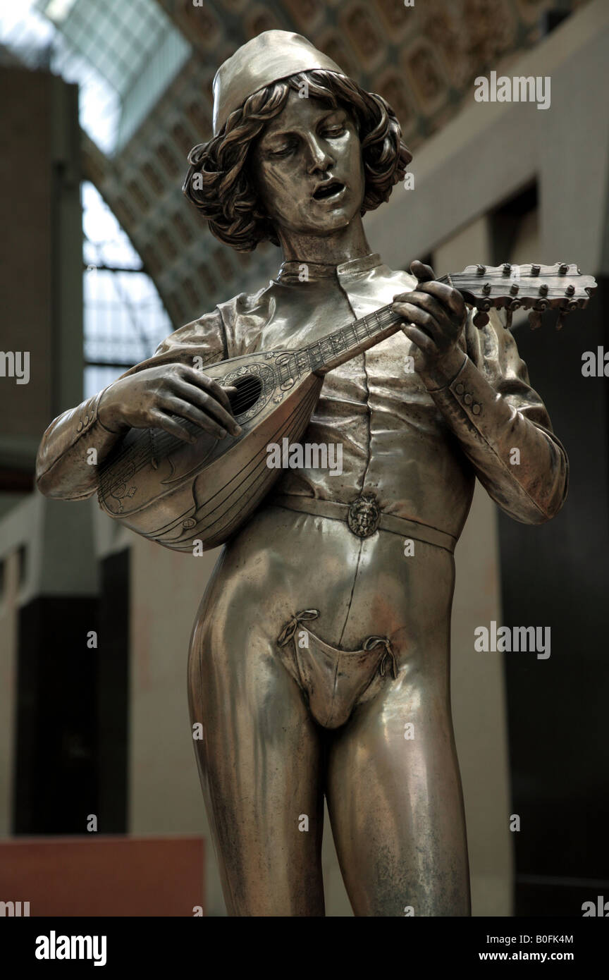 shot of a silvered bronze sculpture of a Florentine Boy Singing and  playing a Lute Stock Photo