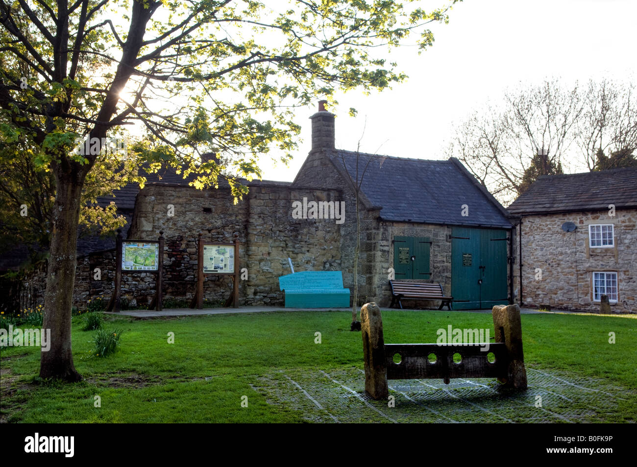 Eyam stocks and Old Market Hall in Derbyshire 'Great Britain' Stock Photo