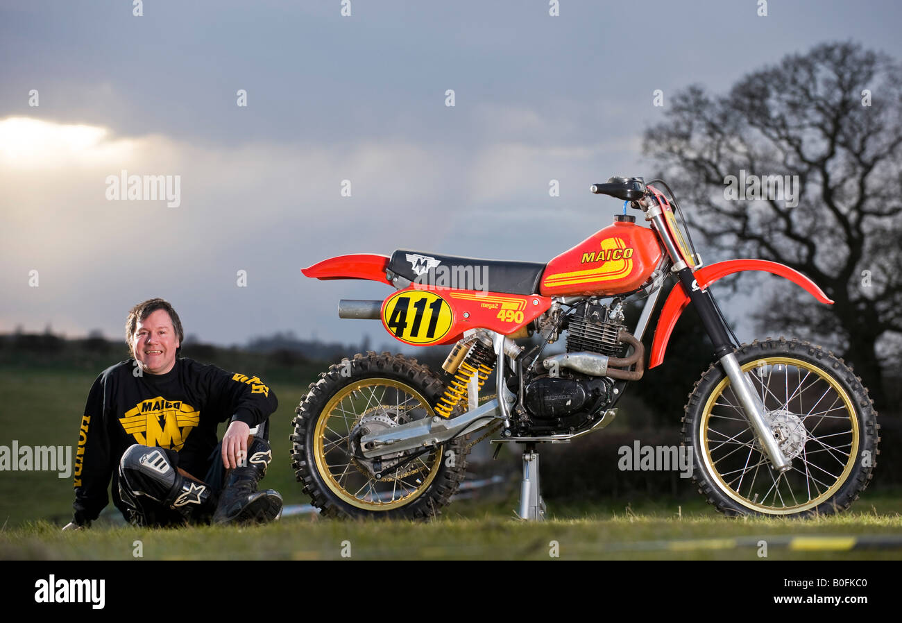 Twin shock vintage motocross rider MX  dirt muddy with knobbly tyres tires twin-shock dirt bike MX Moto-X mudguard power racer r Stock Photo