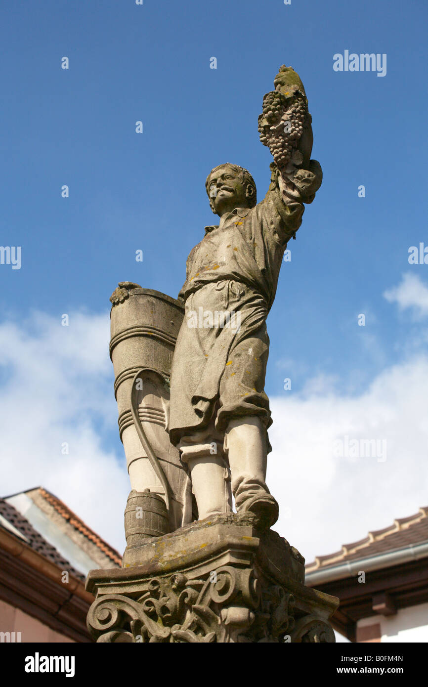 Statue of grape picker at Ribeauville Alsace France Stock Photo