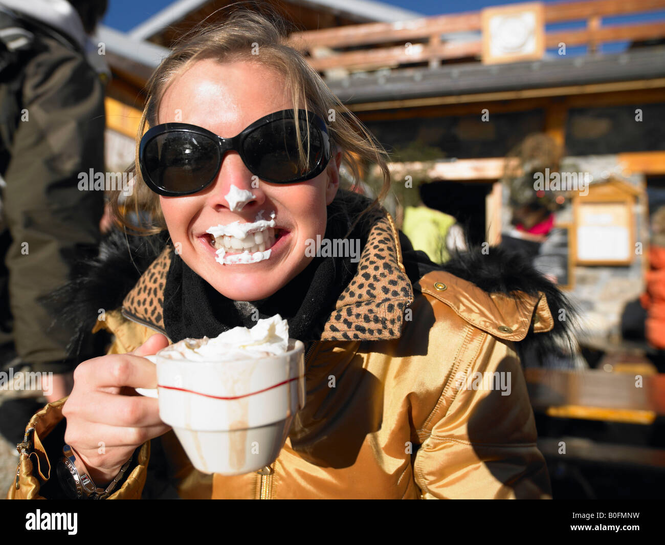 Young woman with whipped cream on lips Stock Photo