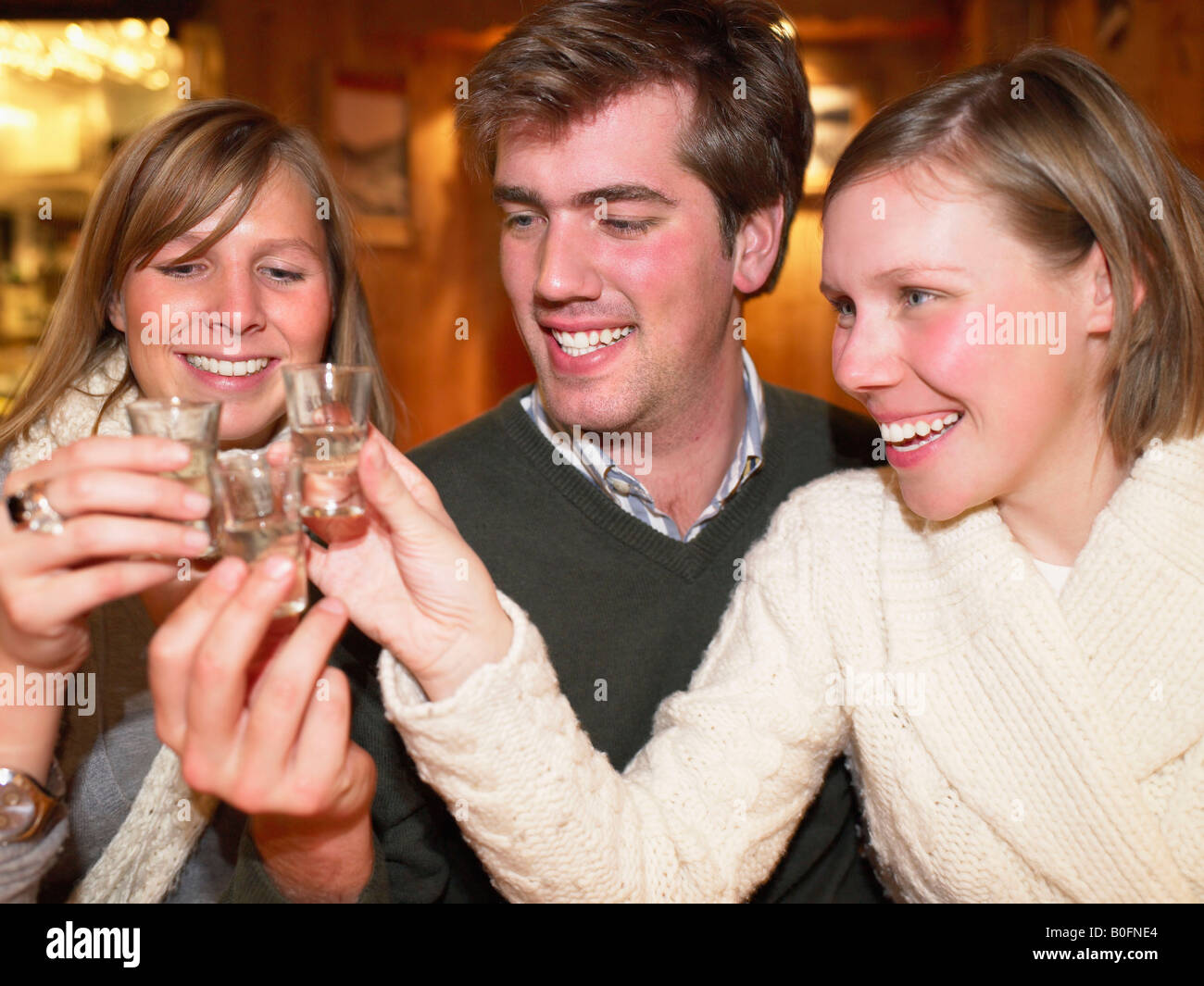 Group having shots in restaurant Stock Photo