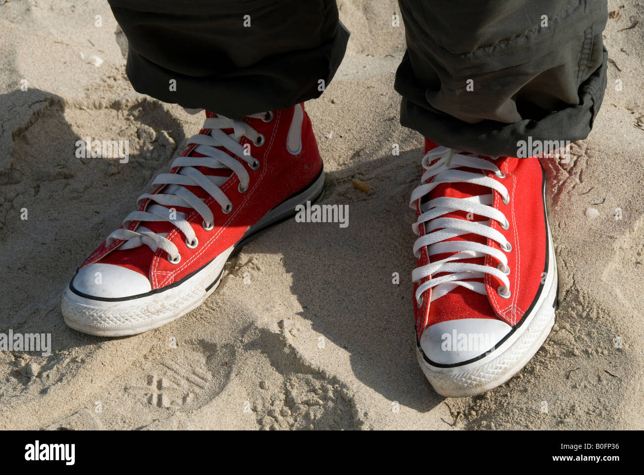 gym-shoes on the sand Stock Photo