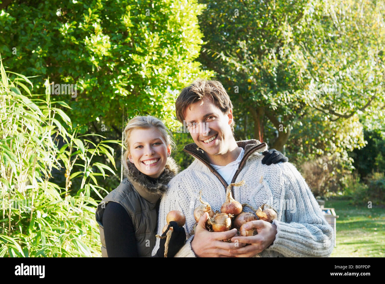 Happy couple gardening Stock Photo - Alamy