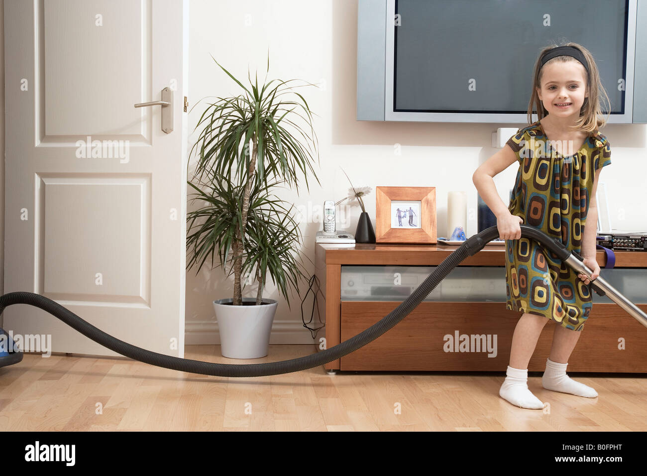 Girl doing housework Stock Photo