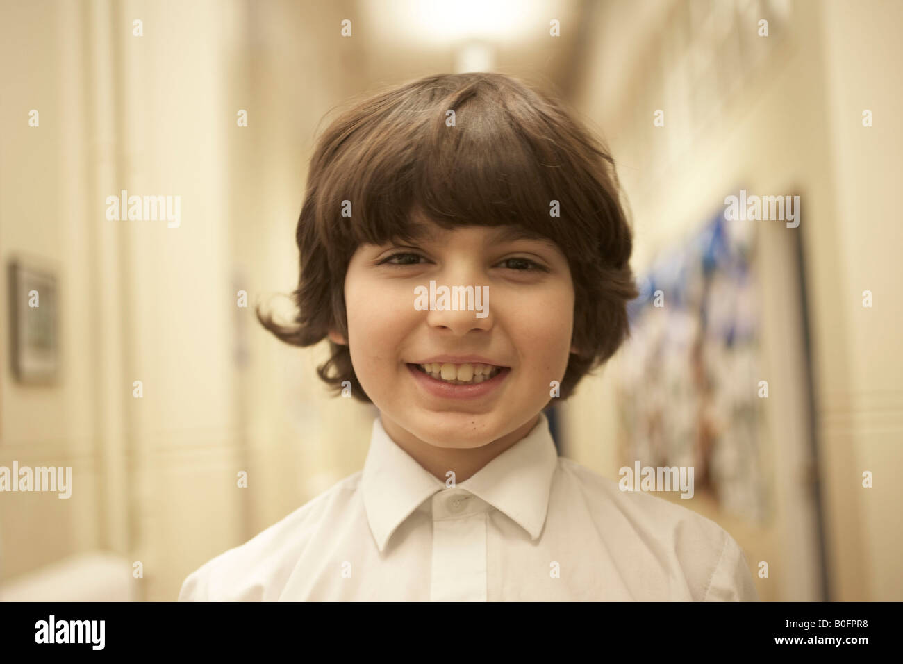Boy standing in school's corridor Stock Photo - Alamy