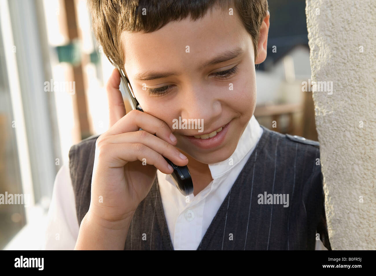 Young boy on cell phone Stock Photo