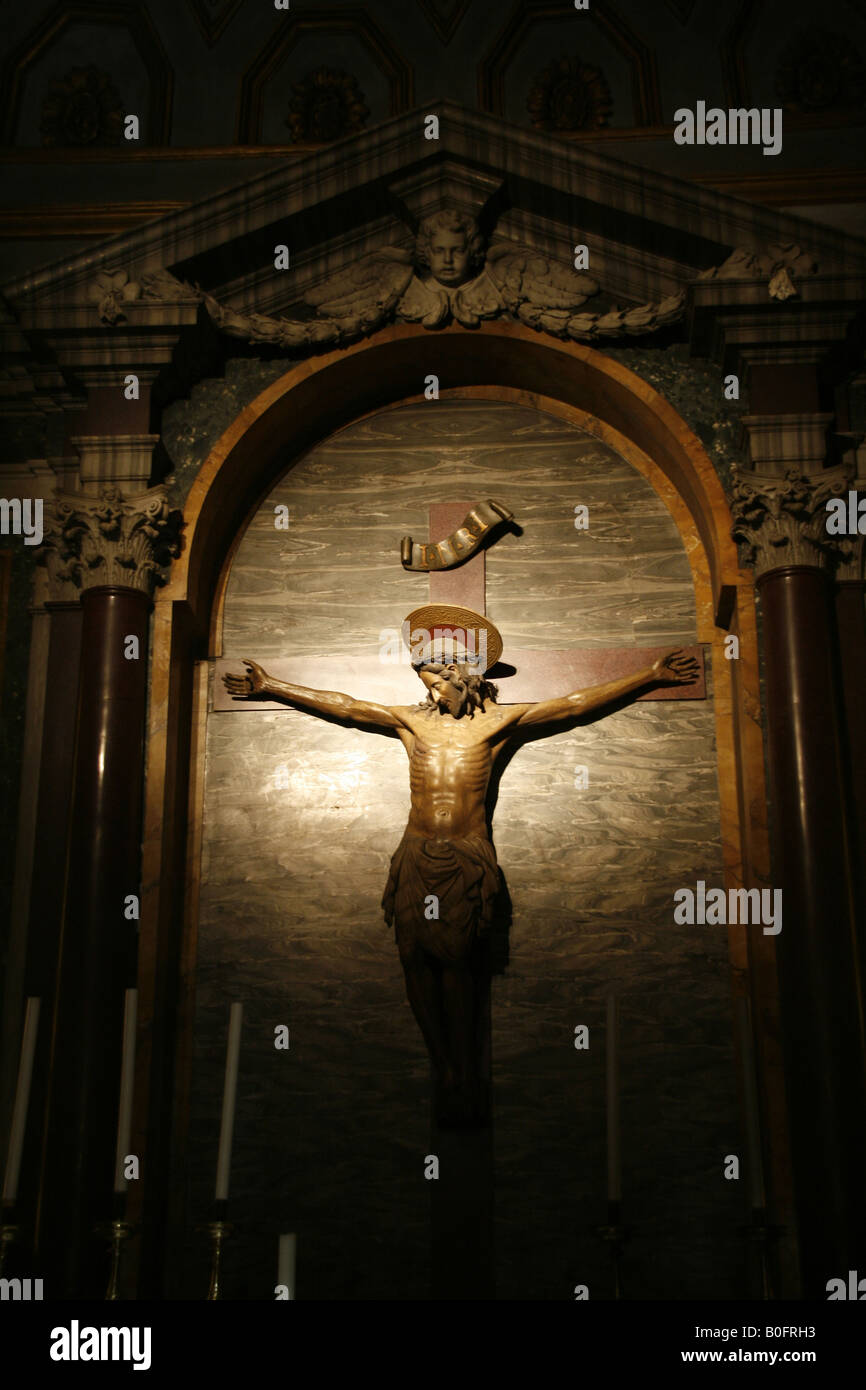 jesus on cross statue in church in rome italy Stock Photo - Alamy