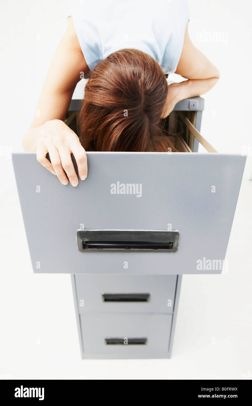 Woman looking for files in Stock Photo Alamy