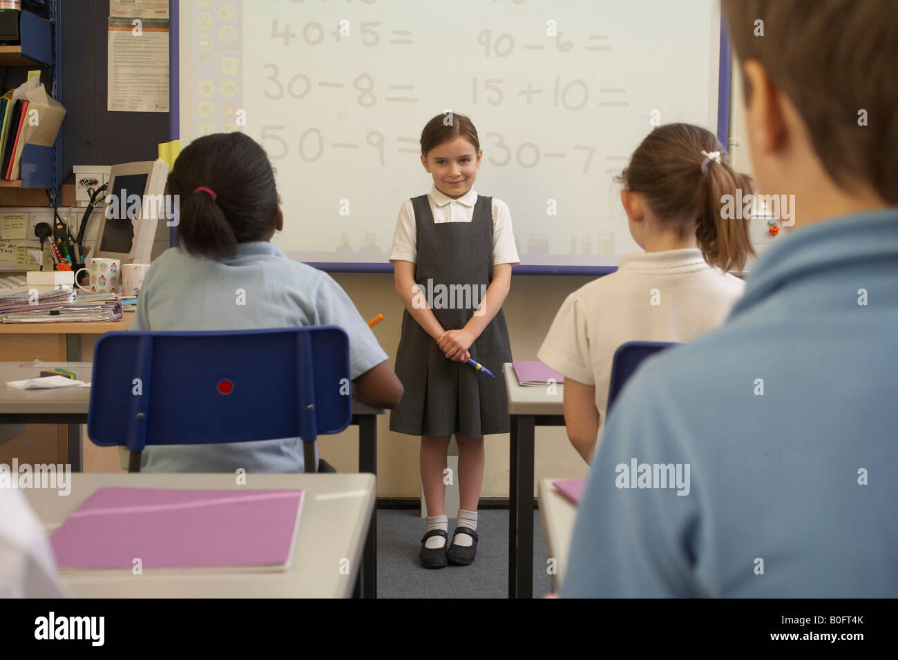 Girl doing her presentation in class Stock Photo Alamy