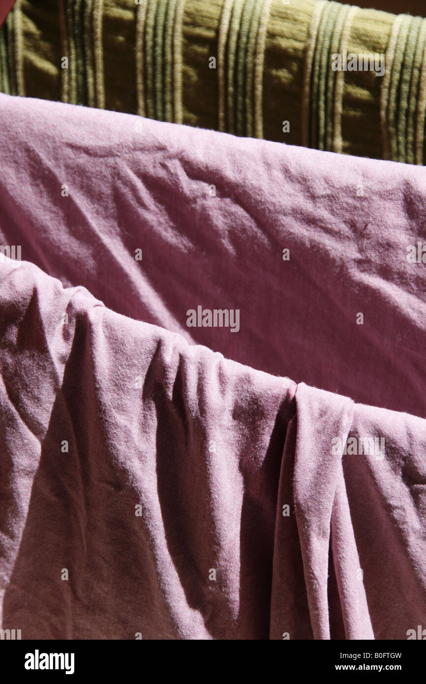 clean bedding sheets hanging on washing line Stock Photo Alamy