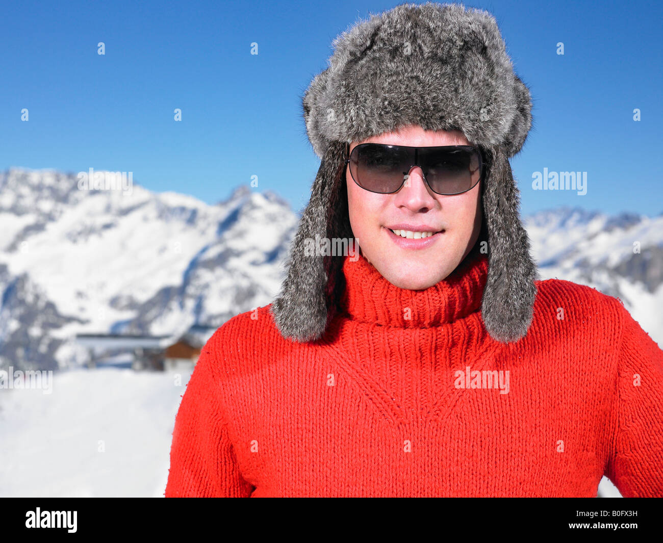 Young man in hat at mountains Stock Photo