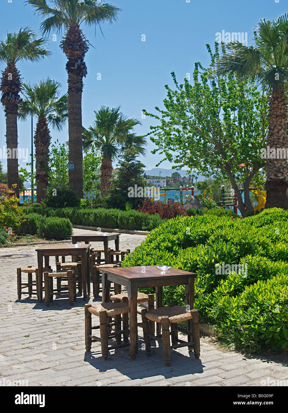 TRADITIONAL TABLE AND CHAIRS SET OUTSIDE CAFE IN HARBOUR AT DATCA