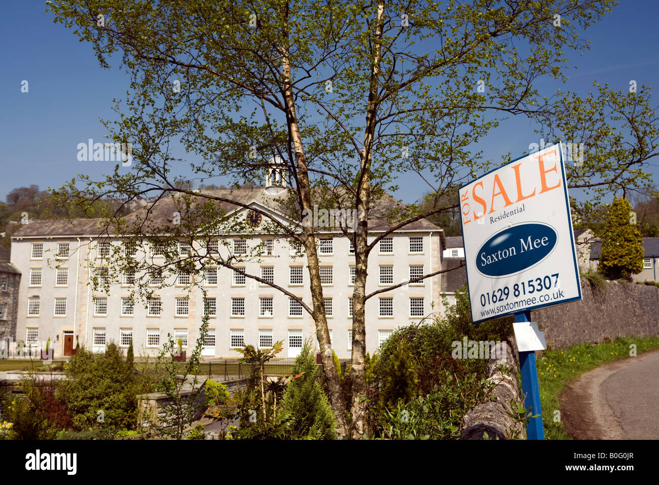 UK Derbyshire Monsal Dale Richard Arkwrights Cressbrook Mill converted to residential apartments for sale board Stock Photo