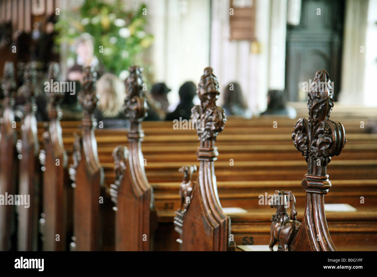 A church with only a few people in the congregation Stock Photo