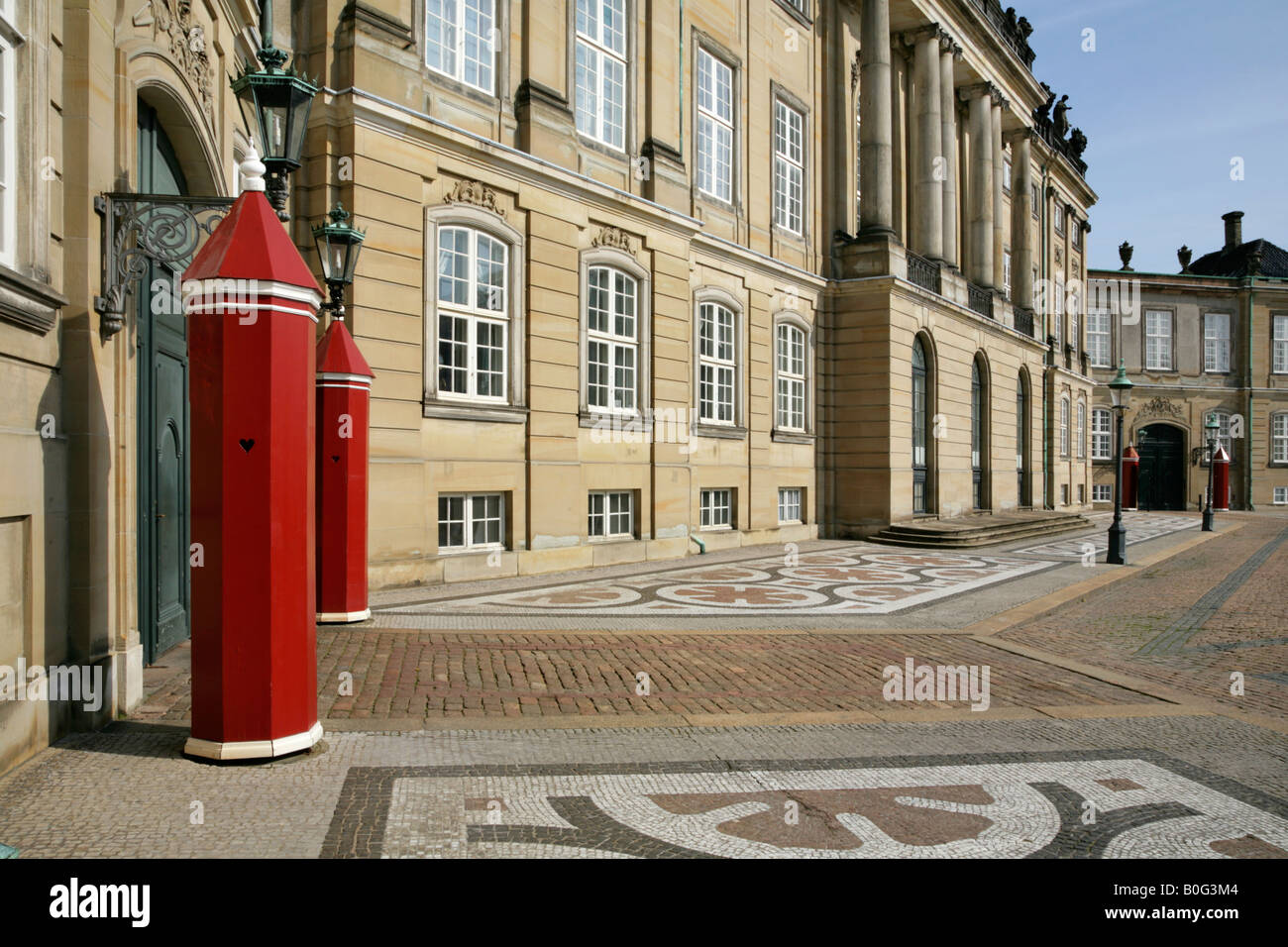 Sentry boxes outside the Royal Palace, residence of the Danish Royal family, Amalienborg Palads, Copenhagen, Denmark. Stock Photo