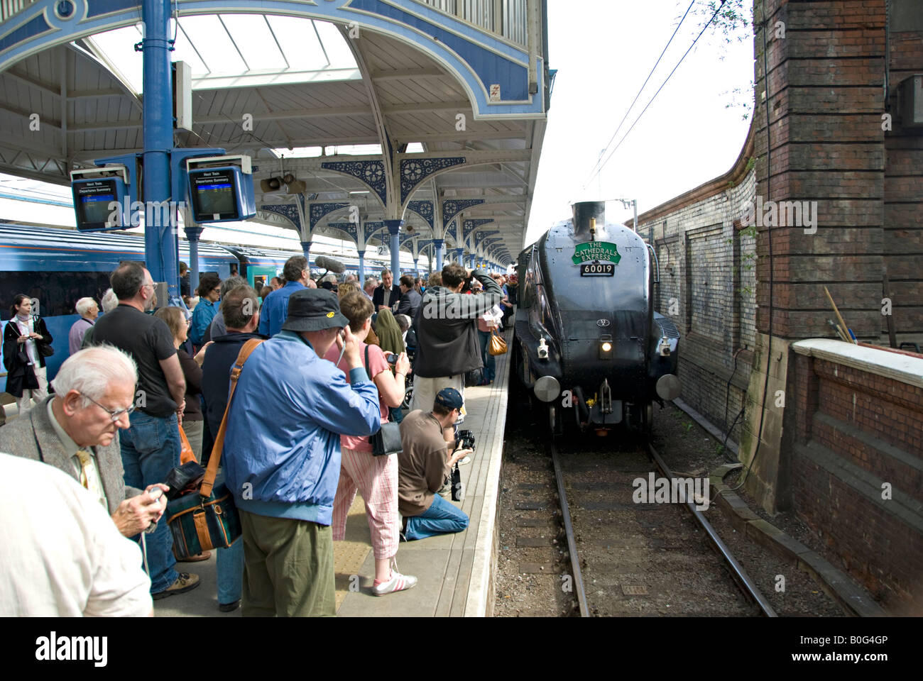 Railway enthusiasts photograph A4 pacific 'Bittern' steam locomotive at Norwich Railway Station. Stock Photo