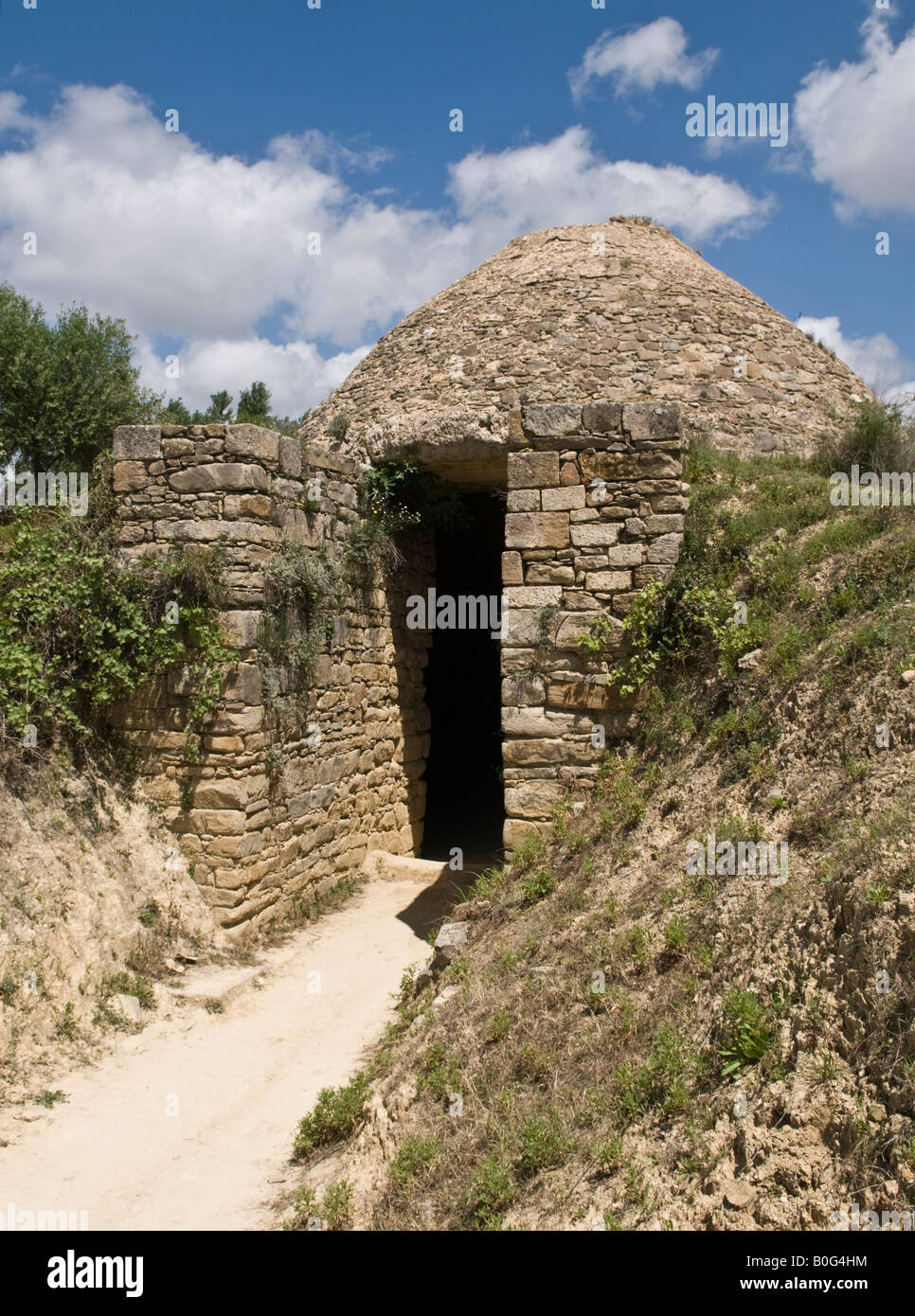 A Mycenaean beehive tomb, tholos, at Nestors palace above Pilos Messinia Southern Peloponnese Greece Stock Photo