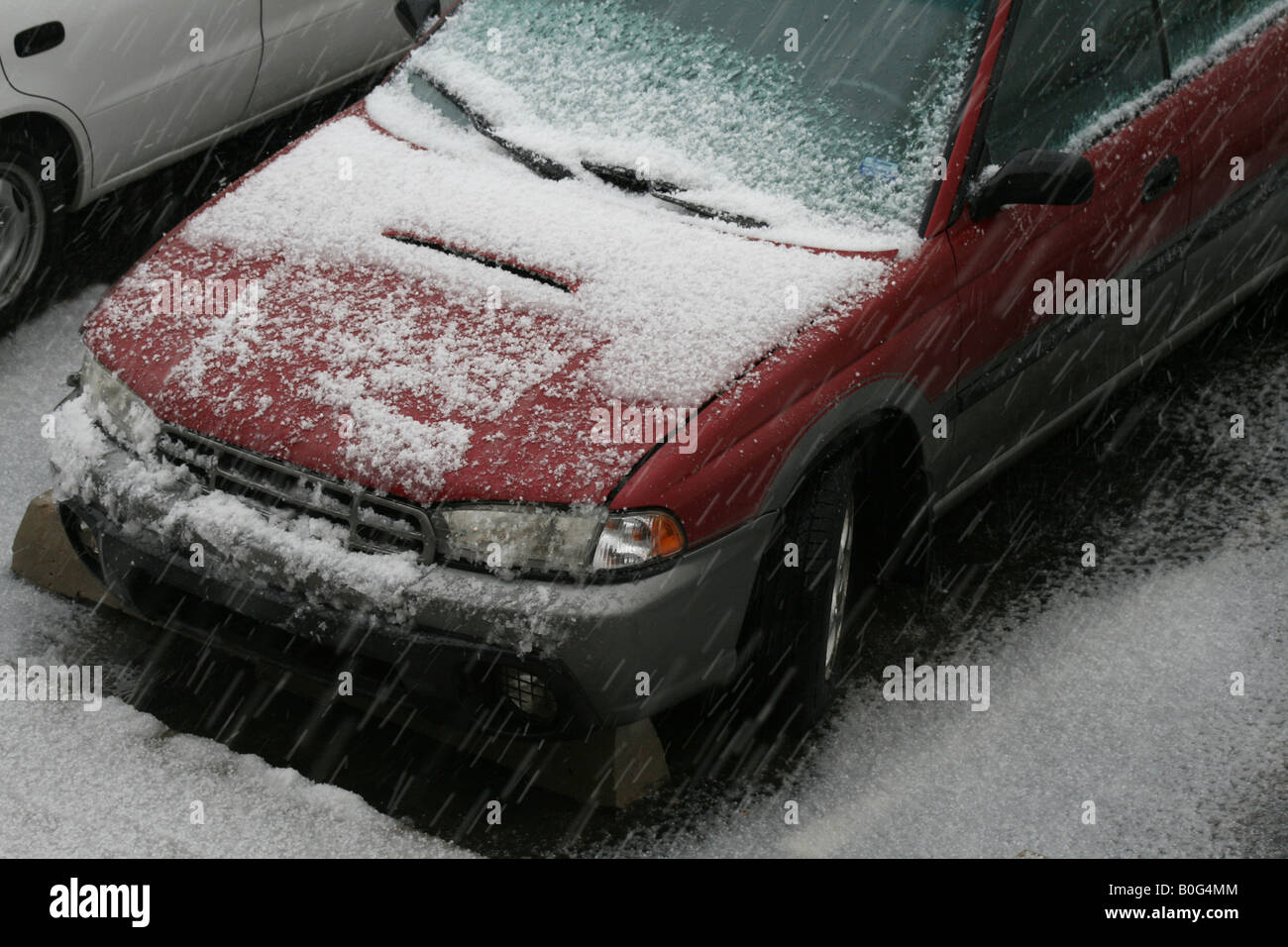 over head view of car, icy snow falling Stock Photo