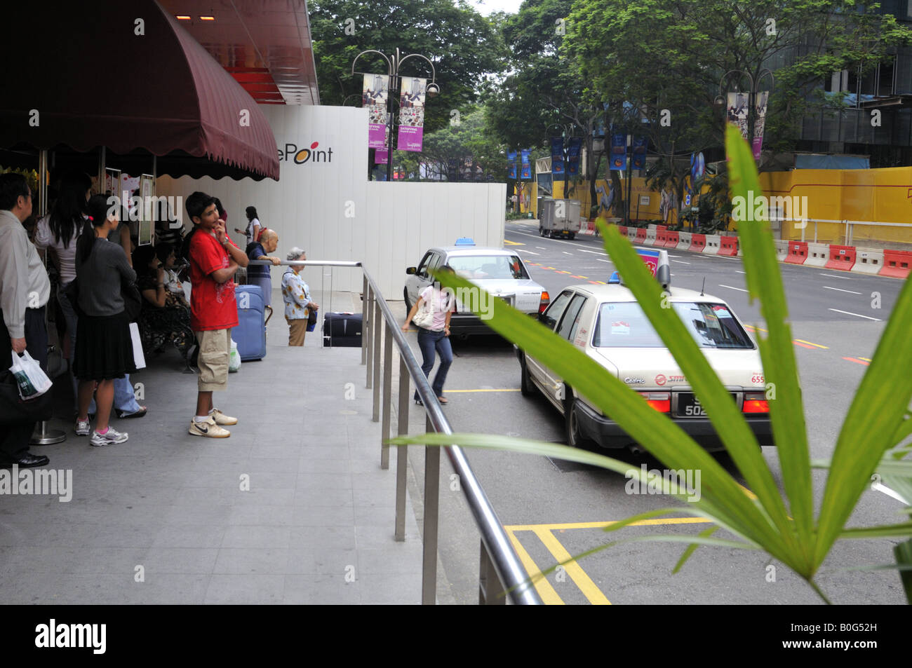 Taxi rank on Orchard Road, Singapore. Stock Photo