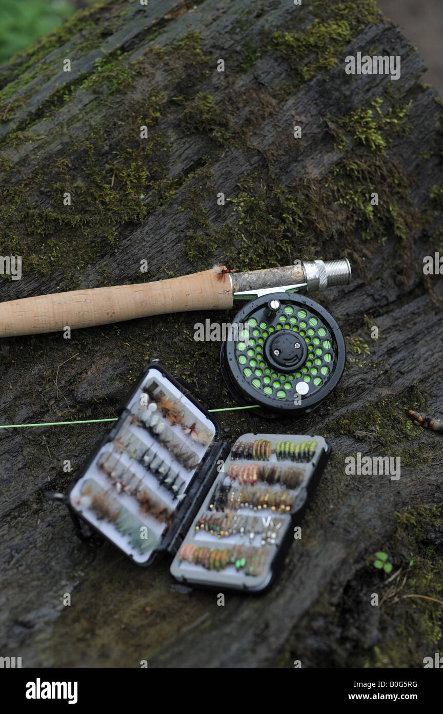 A fly fishing set of tackle, with rod, reel and a box of assorted flies dry  and wet for fishing Stock Photo - Alamy