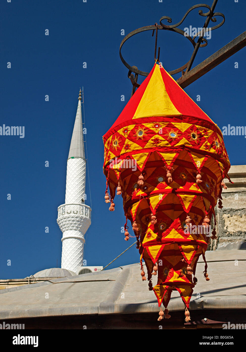 MINARET OF MOSQUE AND CLOTH LIGHT SHADE COVER HANGING ON DISPLAY IN OLD TOWN, MARMARIS MUGLA TURKEY Stock Photo