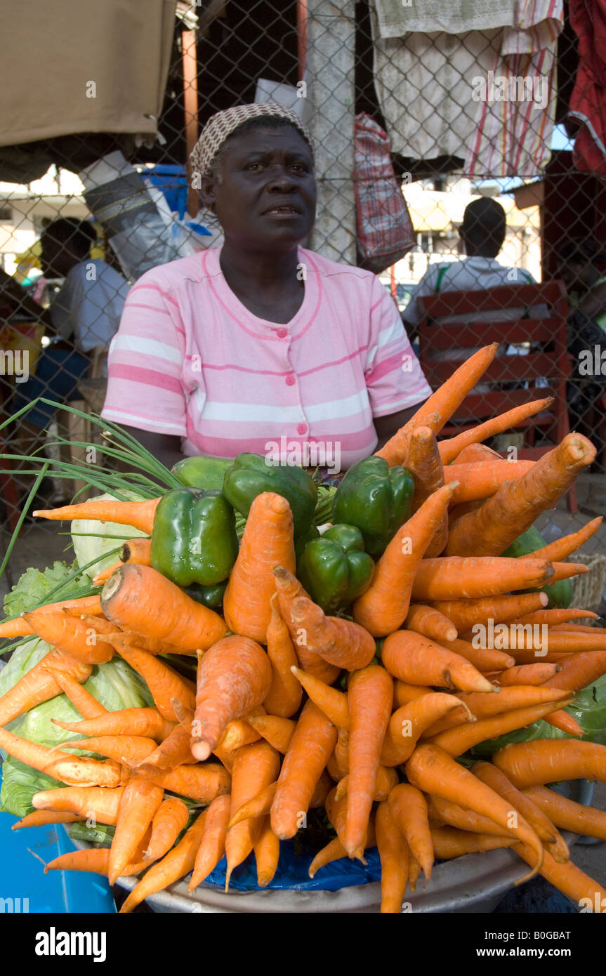 Woman offering fresh vegetables in the streets of Accra, Ghana Stock
