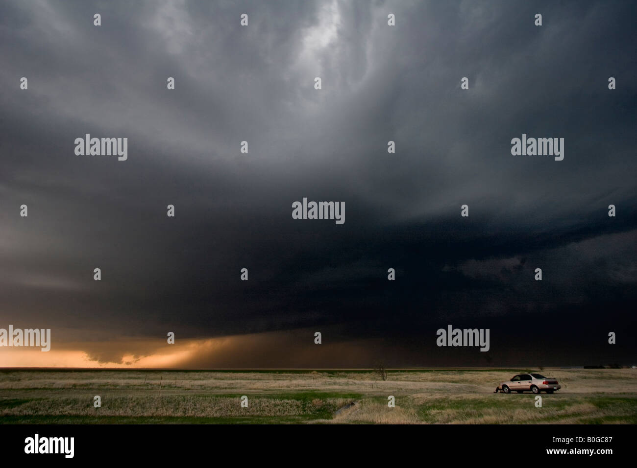 A storm chaser watches a tornado warned supercell thunderstorm in North ...