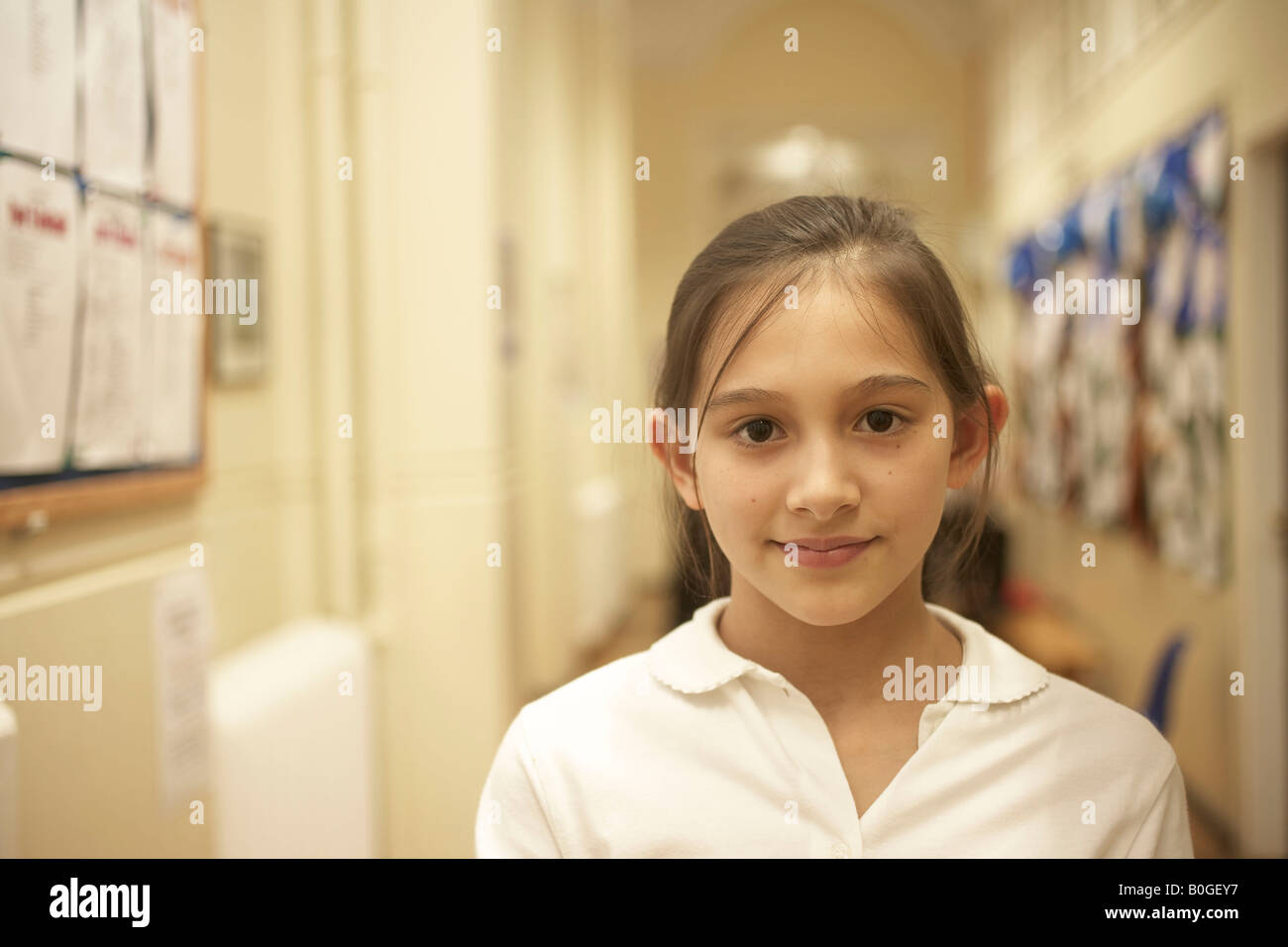 Girl standing in school's corridor Stock Photo - Alamy