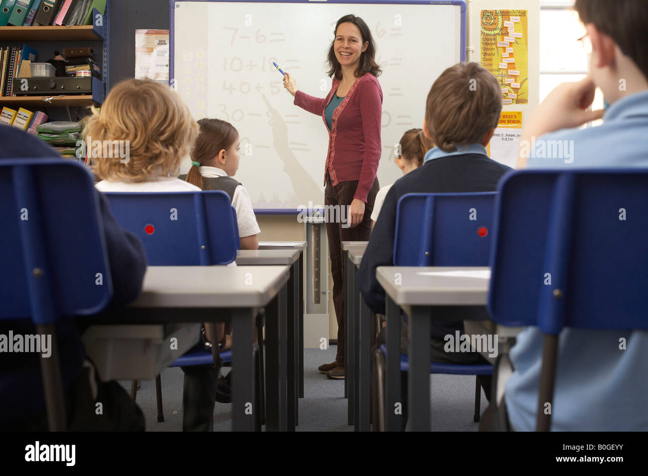 Teacher teaching in classroom Stock Photo