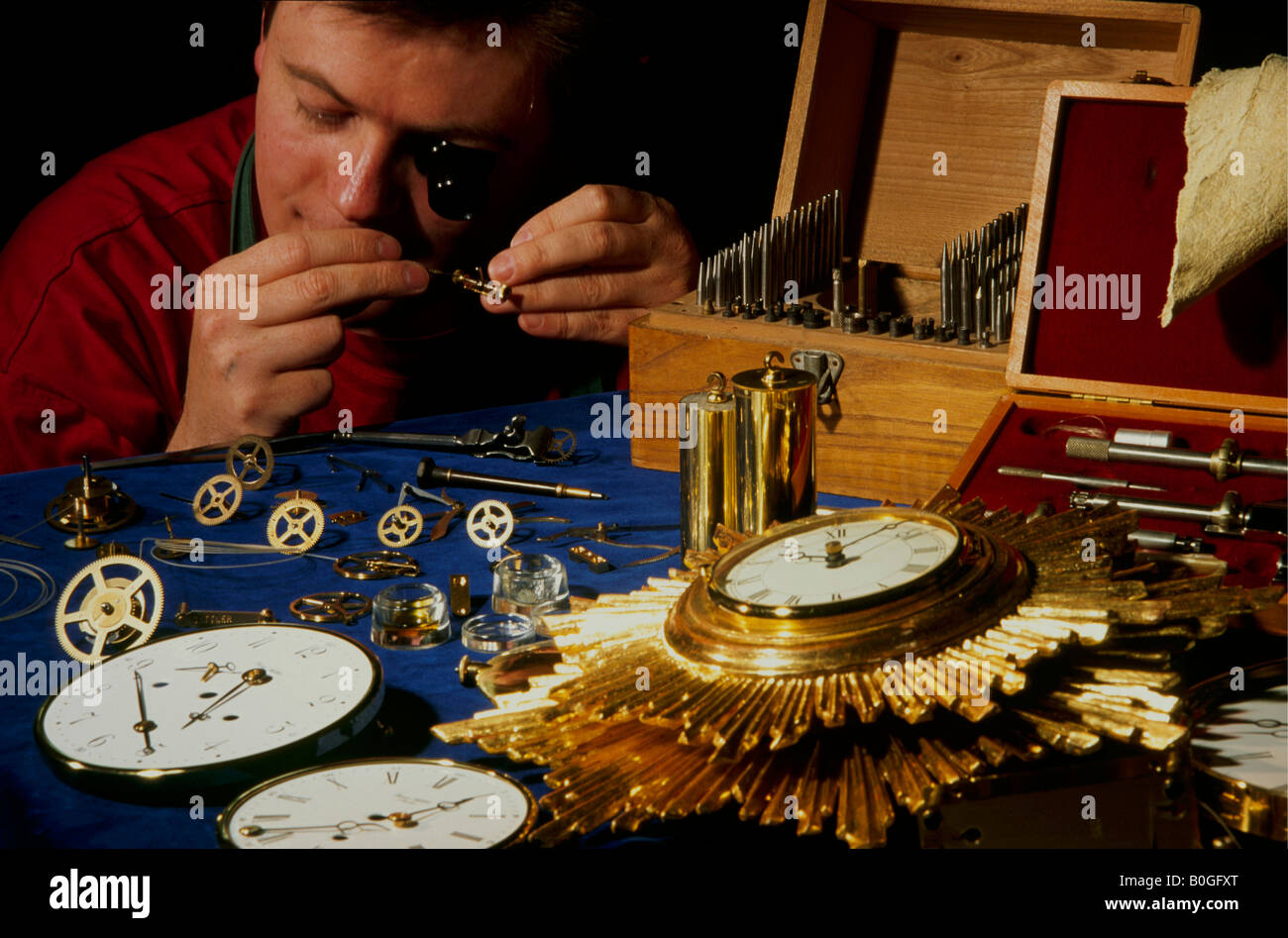 A clock maker at work, Berlin, Germany Stock Photo Alamy
