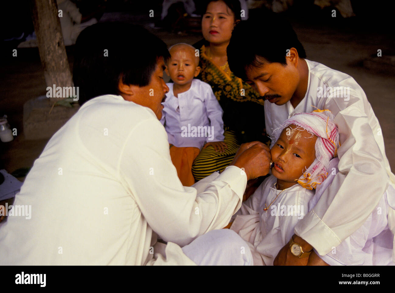 An earpiercing ceremony for the PreHindu rite of passage, in a temple