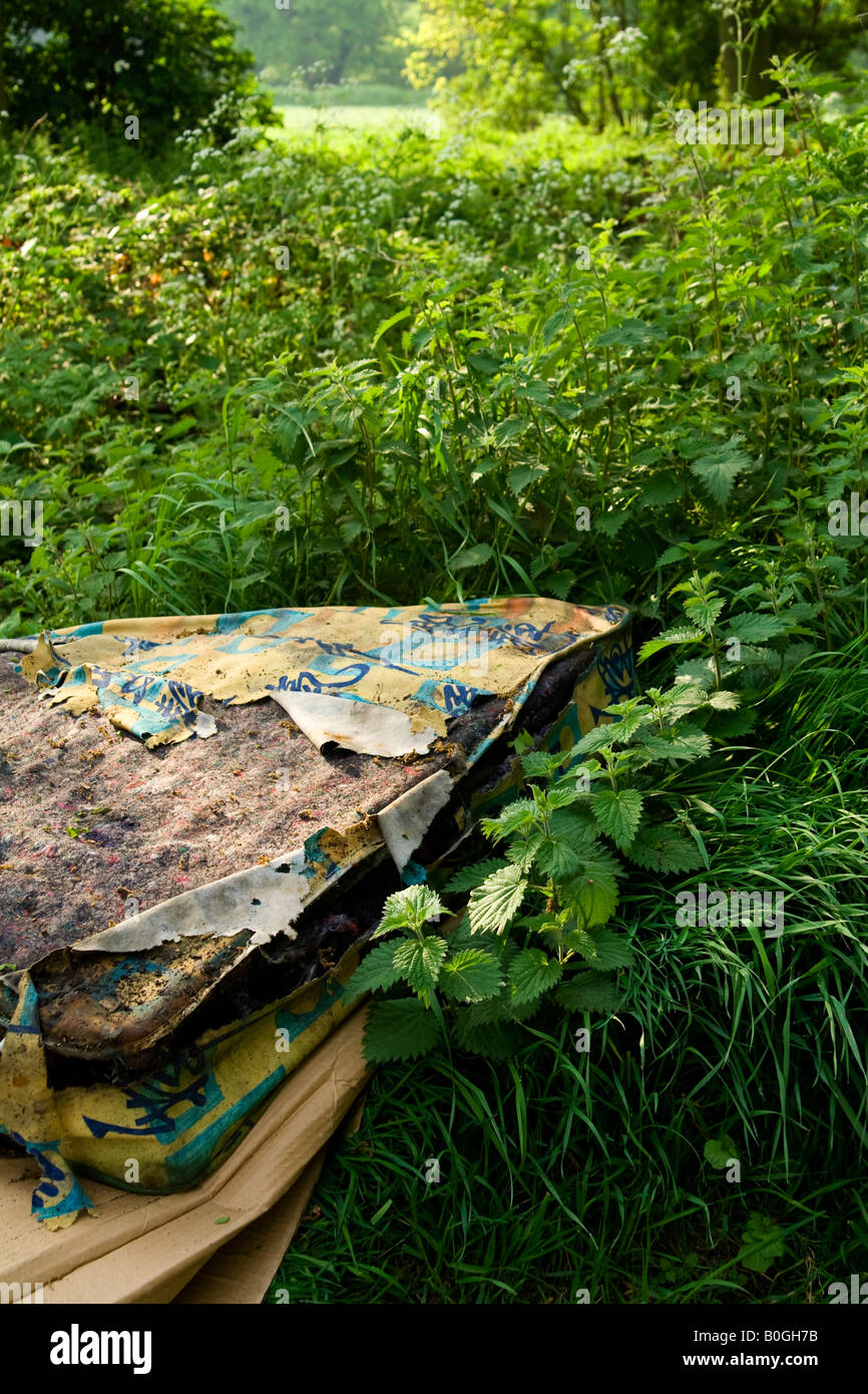 Fly tipping fly tipping dump old mattress rubbish trash waste uk hires