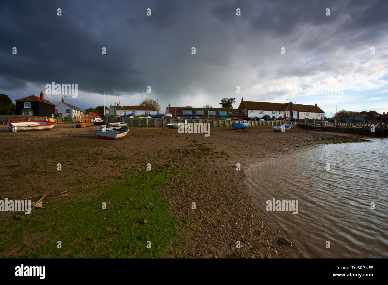 A view of Burnham Overy Staithe on the North Norfolk Coast on a moody spring afternoon Stock Photo