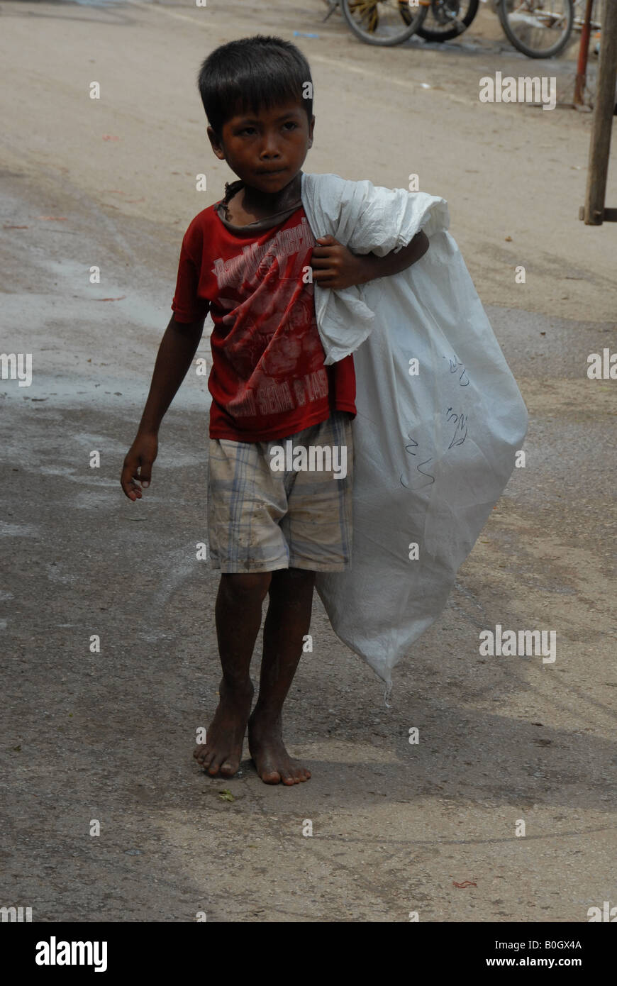 khmer boy at thai cambodian border, aranyaprathet market , thailand Stock Photo