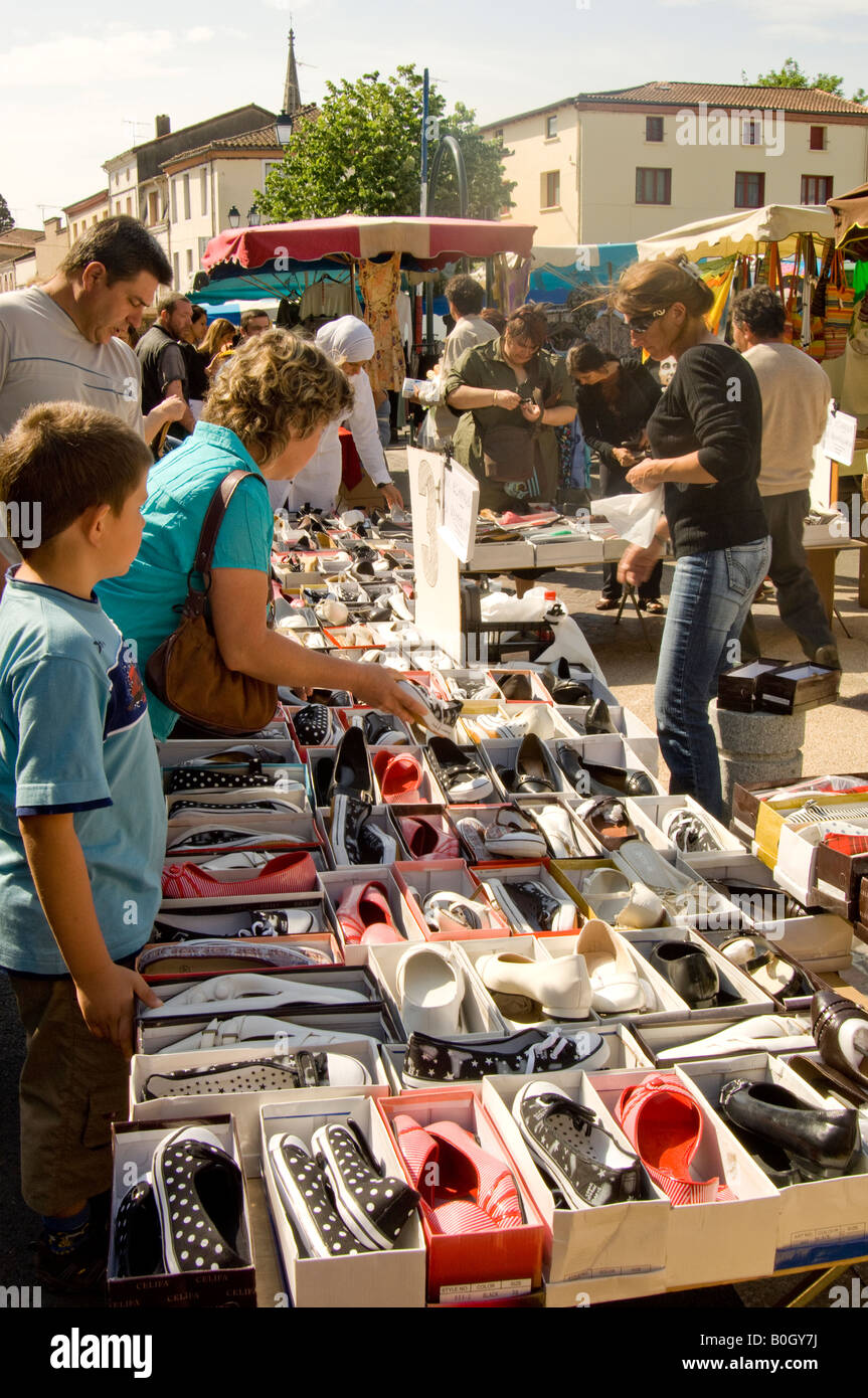 Cheap shoes on sale outdoor market in Moissac Stock Photo