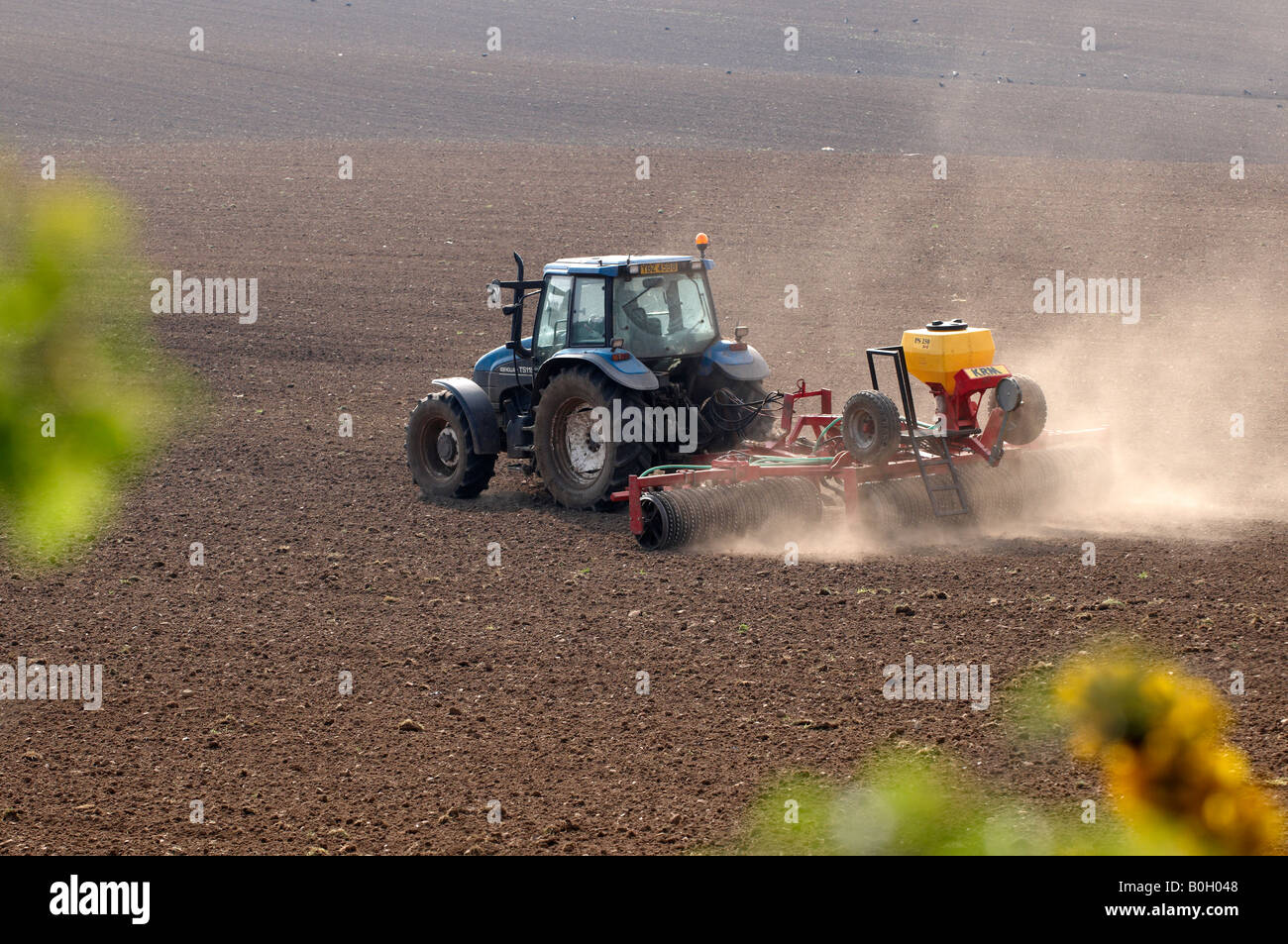 Tractor working dry arid ground Stock Photo Alamy