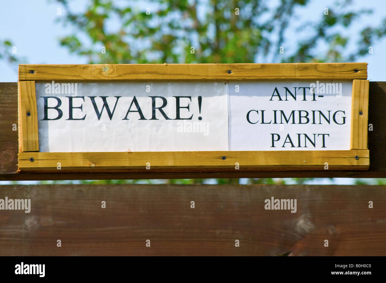 BEWARE! Anticlimbing paint sign Stock Photo Alamy