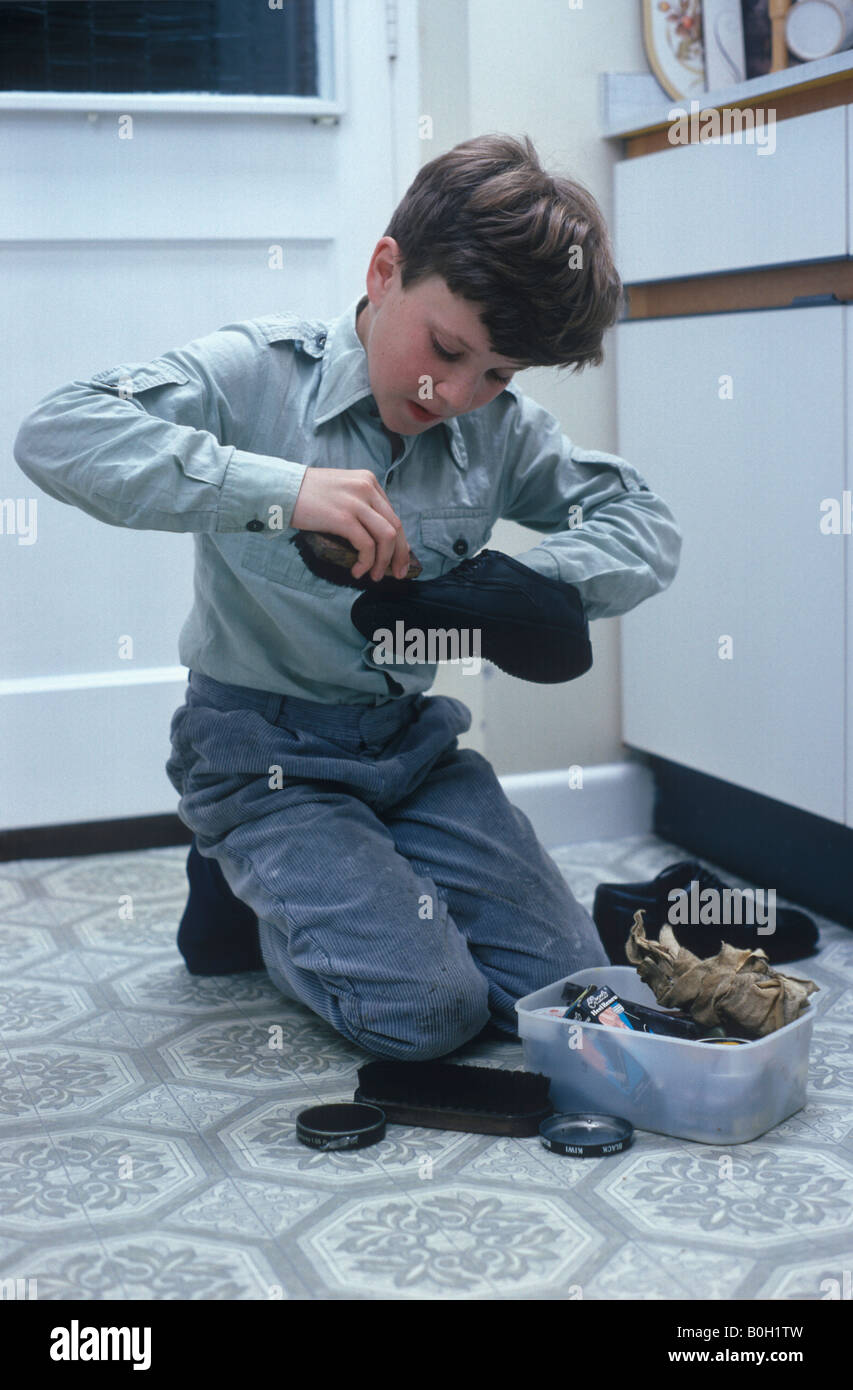 child cleaning shoes Stock Photo - Alamy