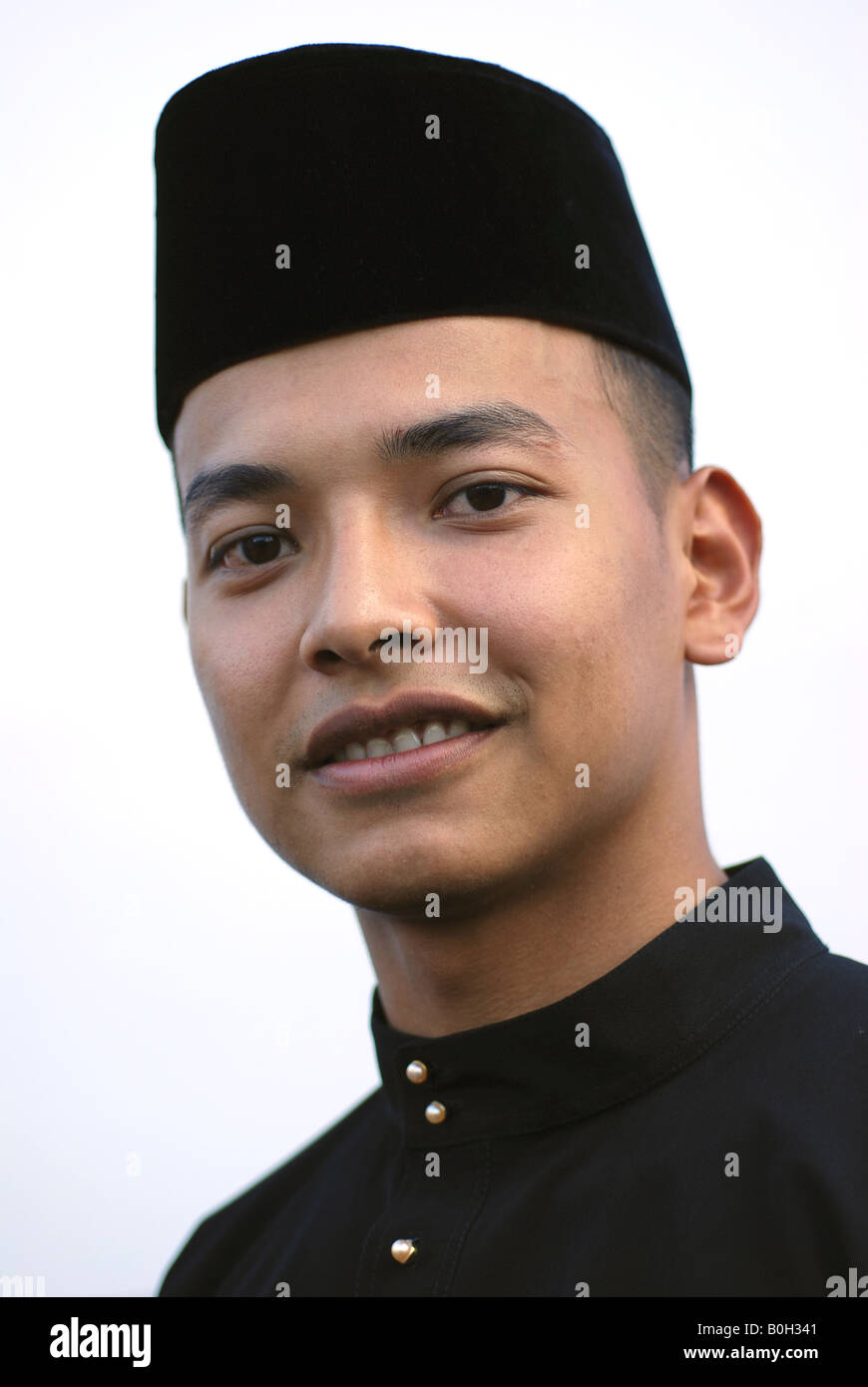Malay male adult wearing songkok Stock Photo - Alamy