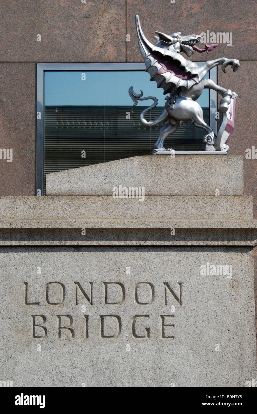 London Bridge sign and dragon against modern office building London UK Stock Photo