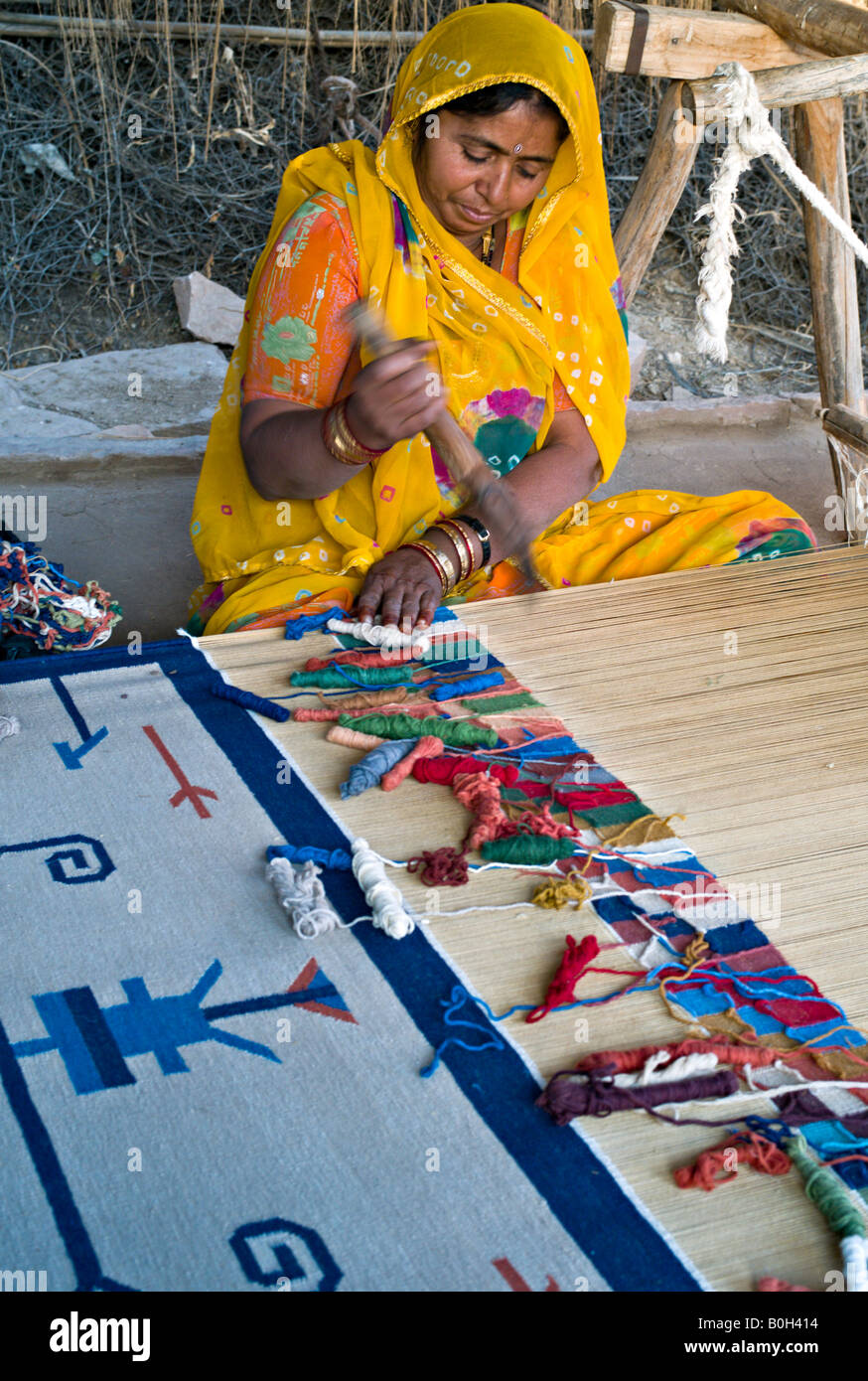 INDIA SALAWAS Indian woman with tattooed hands weaving dhurries in the